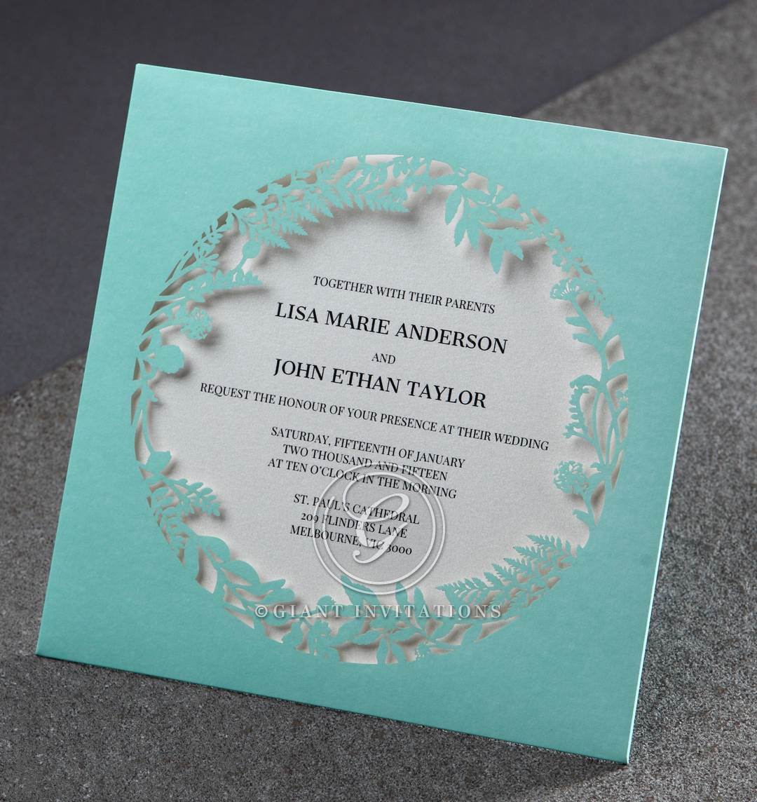 Laser cut pocket invitation featuring a wreath window, pearl paper ...
