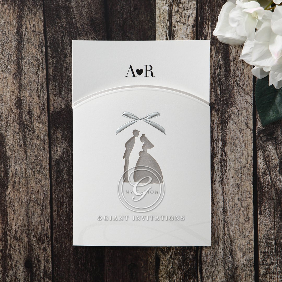 Uniquely shaped gatefold invite with a bride and groom die cut center, embellished with embossed silver foiled ribbon
