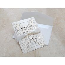 Ribboned laser cut floral invitation; ivory inner paper
