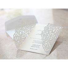 Open floral gatefold invitation with ribbon