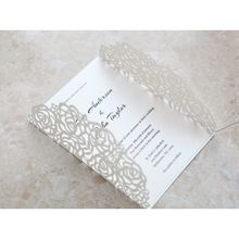 White laser cut card in beige inner card; opened flaps