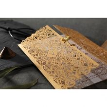 Classic white inner card with raised ink print, draped with an intricate laser cut sleeve adorned with a wild lotus flower seal