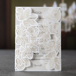 Dazzling pearlised inner card printed in raised ink enclosed in a sophisticated die cut floral laser cut design, encased in a matching pearl envelope with silk lining
