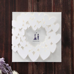 Classic matte white insert paper in calligraphic writing attached to a lovely outer card with bride and groom silhouette bordered by fluttering hearts
