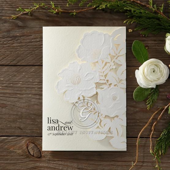 Lightly textured invite with a stunning embossed laser cut floral front cover, embellished with golden dots on front and back

