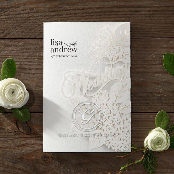 Embossed floral details in white and brown coloured invite, with gold foiled lettering enclosing a lightly textured inner paper 
