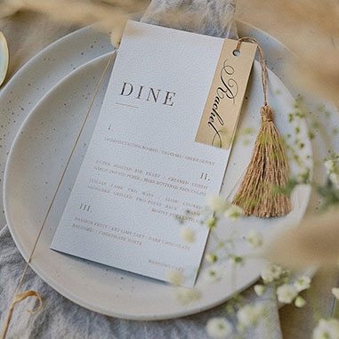 menu cards with names and tassel