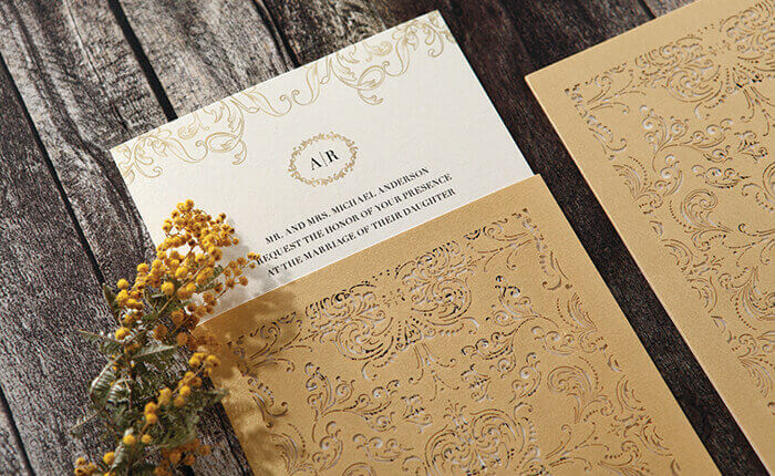 A golden baroque laser cut pocket sleeve with ivory insert and gold detailing